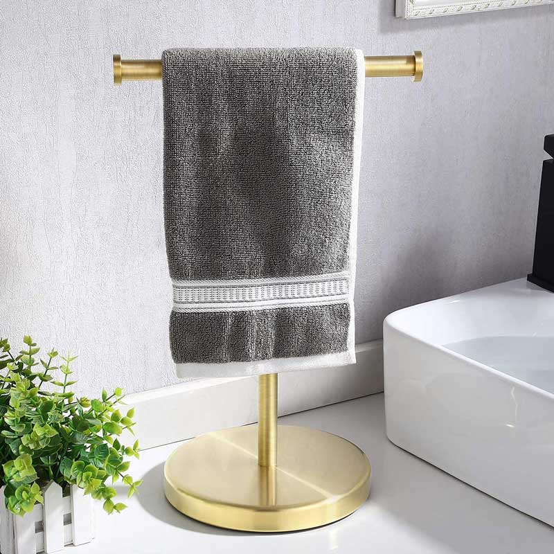 Gold toilet paper holder wall